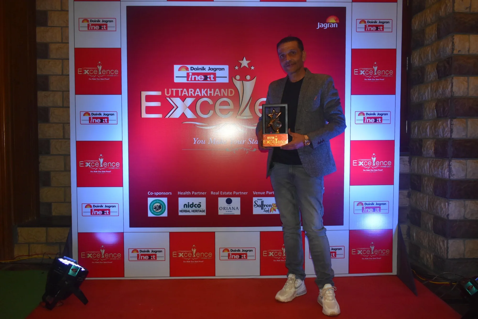 Founder Ravinder Singh receiving recognition at a community award ceremony