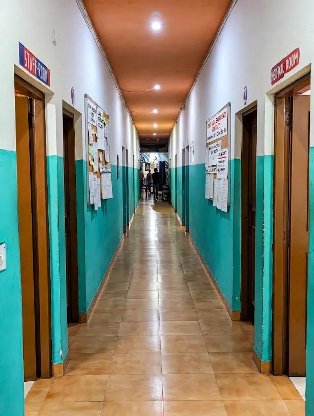 Bright interior corridor with rooms on both sides