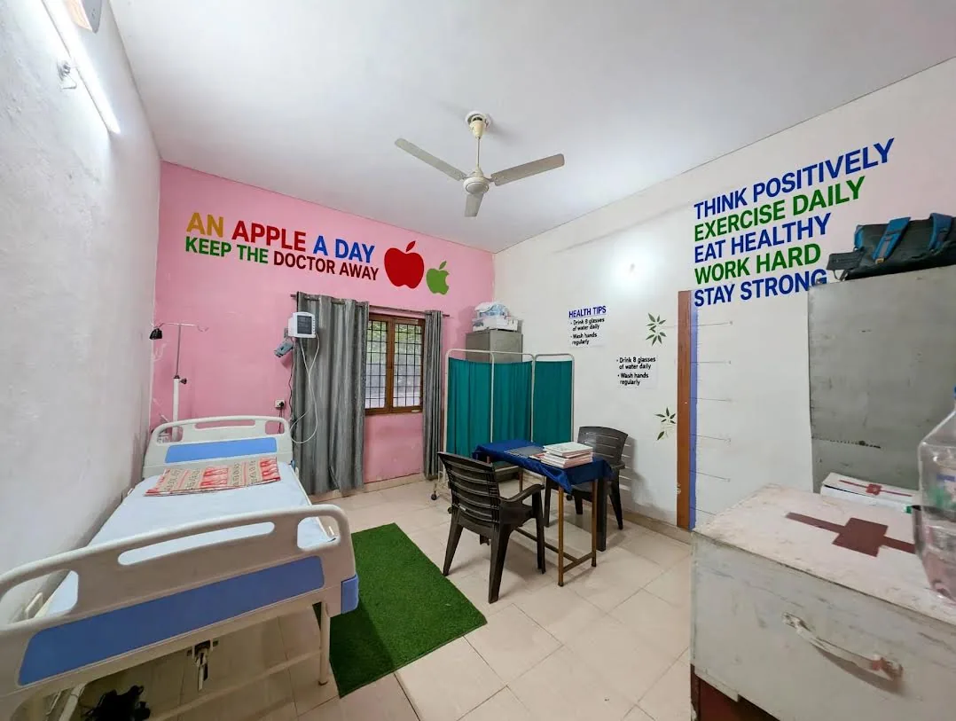 Medical room at the centre with examination bed and screen